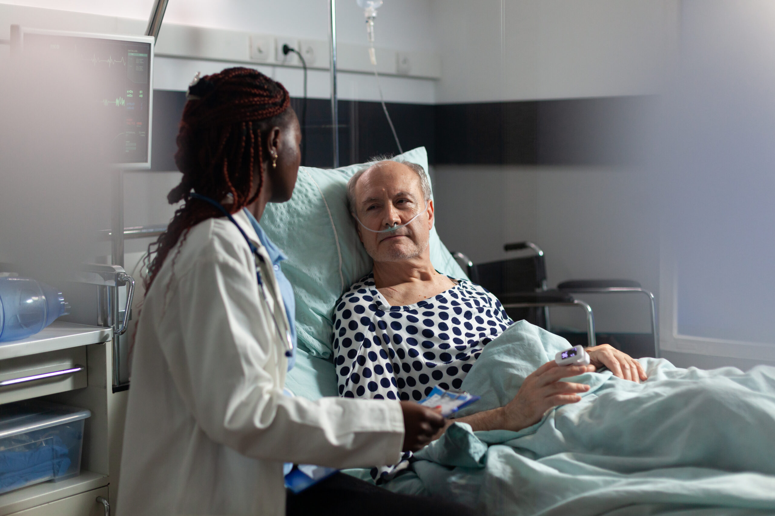 a senior patient in a hospital bed for cardiac ablation recovery